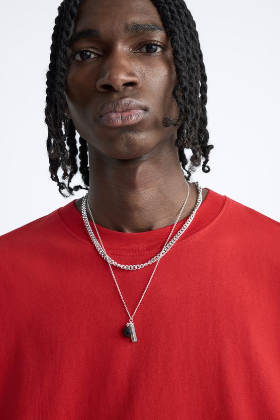 T-SHIRT À INSCRIPTION DÉFORMÉE